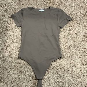 aritzia taupe bodysuit in a size m